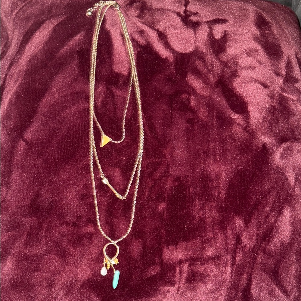 Long three tier strand necklace